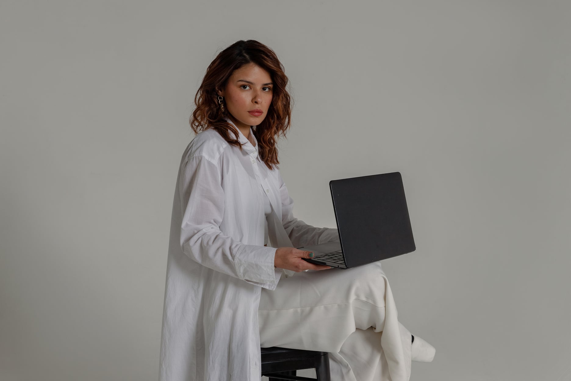 Professional Diverse Team Female Professional with a Laptop